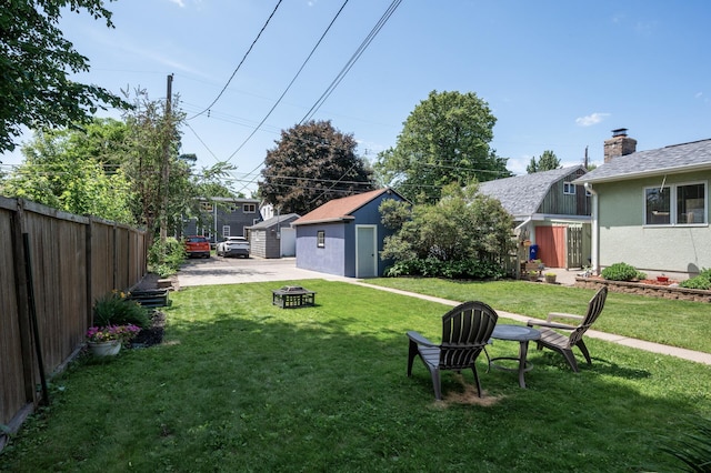 1407 Pascal St N, Saint Paul, MN 55108 - view of yard featuring a fire pit and a storage unit