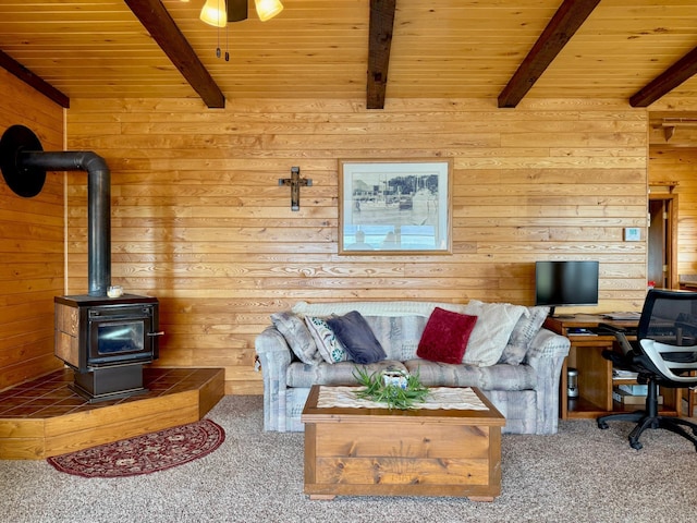 3025 Viewpoint Rd, Isle, MN 56342 - living room with carpet floors, a wooden ceiling with exposed beams, wood walls, a wood stove, and an office area