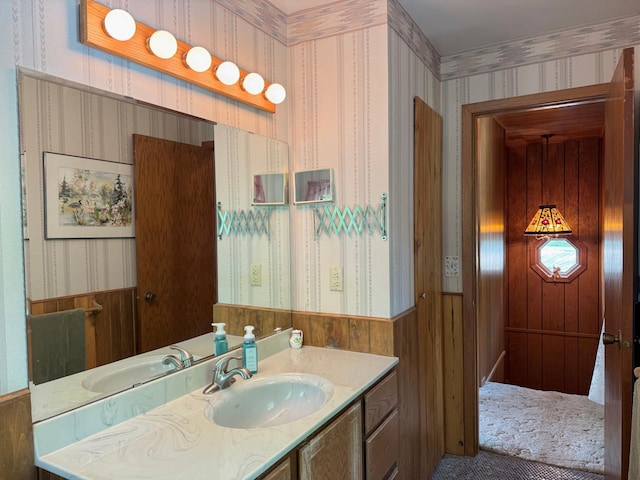 3025 Viewpoint Rd, Isle, MN 56342 - bathroom with wallpapered walls, vanity, wainscoting, and wood walls