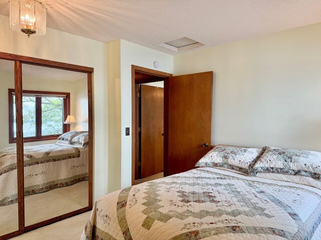 3025 Viewpoint Rd, Isle, MN 56342 - carpeted bedroom with attic access