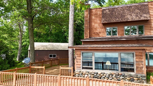 3025 Viewpoint Rd, Isle, MN 56342 - rear view of house with a wooden deck and roof with shingles