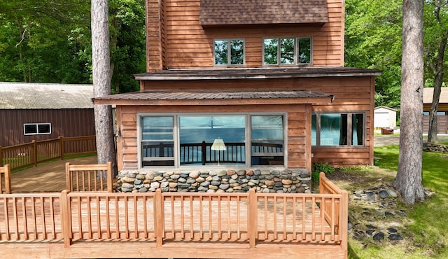 3025 Viewpoint Rd, Isle, MN 56342 - back of property featuring a wooden deck and a shingled roof
