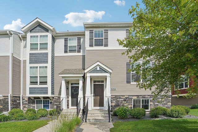 8169 Central Park Way N, Maple Grove, MN 55369 - townhome / multi-family property featuring stone siding