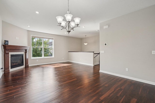 8169 Central Park Way N, Maple Grove, MN 55369 - unfurnished living room featuring wood finished floors, recessed lighting, a tile fireplace, and a chandelier