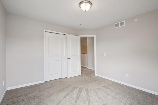 8169 Central Park Way N, Maple Grove, MN 55369 - unfurnished bedroom featuring carpet flooring and a closet