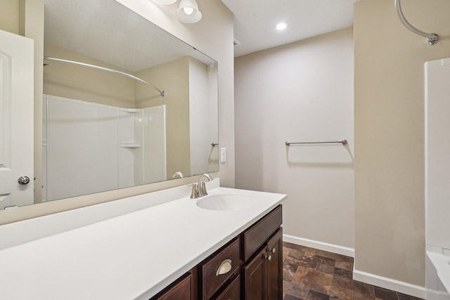 8169 Central Park Way N, Maple Grove, MN 55369 - bathroom with stone finish floors, vanity, and recessed lighting
