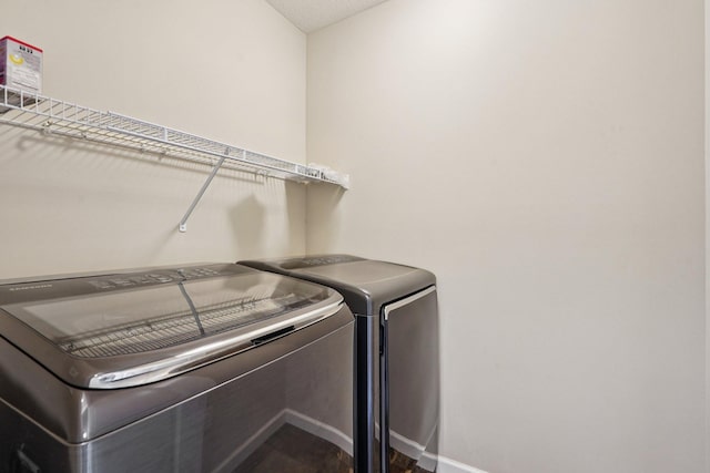 8169 Central Park Way N, Maple Grove, MN 55369 - laundry area with independent washer and dryer and dark wood-style flooring