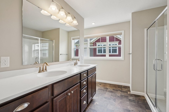 8169 Central Park Way N, Maple Grove, MN 55369 - full bathroom featuring double vanity, stone finish floors, and a stall shower