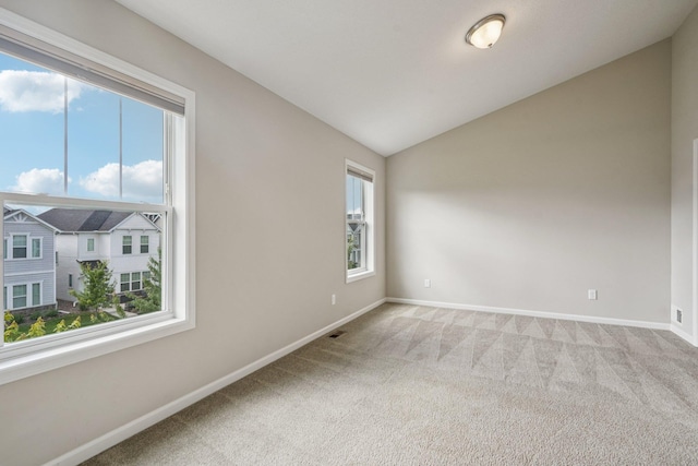 8169 Central Park Way N, Maple Grove, MN 55369 - spare room with light carpet and vaulted ceiling