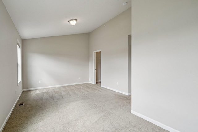 8169 Central Park Way N, Maple Grove, MN 55369 - carpeted empty room with high vaulted ceiling and a smoke detector
