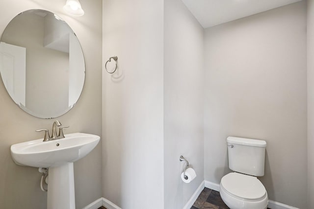 8169 Central Park Way N, Maple Grove, MN 55369 - bathroom featuring toilet and baseboards
