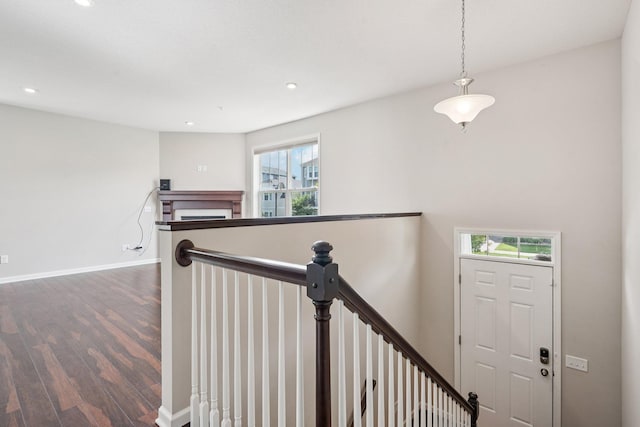 8169 Central Park Way N, Maple Grove, MN 55369 - stairway featuring wood finished floors, healthy amount of natural light, recessed lighting, and a fireplace