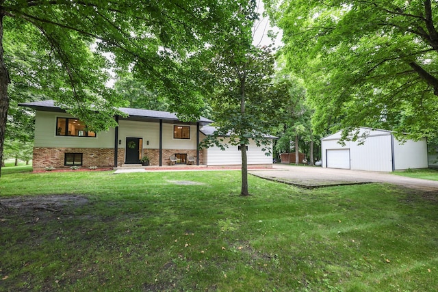 7719 Canary Rd SW, Alexandria, MN 56308 - view of front facade featuring an outdoor structure, a garage, a front lawn, and brick siding