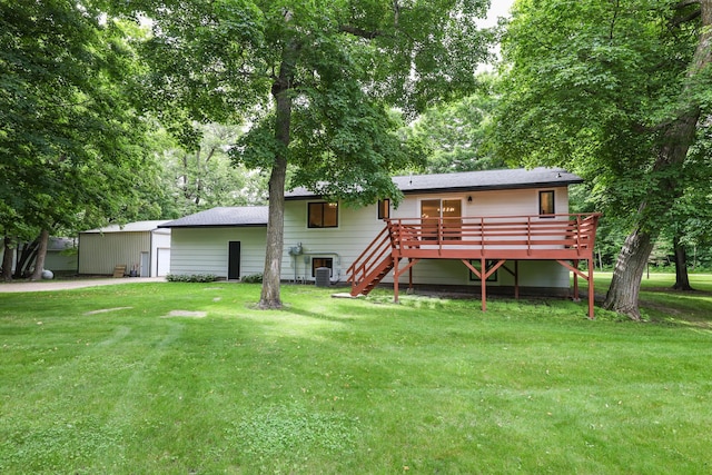 7719 Canary Rd SW, Alexandria, MN 56308 - rear view of house with a deck, a lawn, and stairs