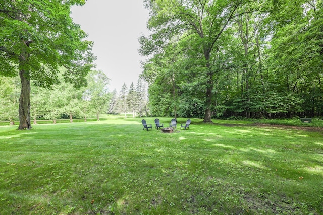 7719 Canary Rd SW, Alexandria, MN 56308 - view of green lawn featuring an outdoor fire pit