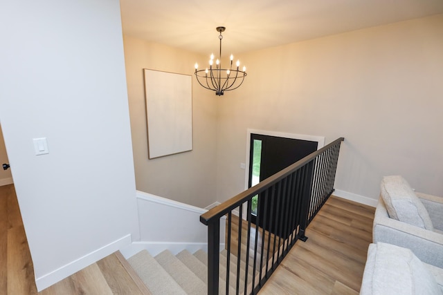 7719 Canary Rd SW, Alexandria, MN 56308 - staircase with a chandelier and wood finished floors