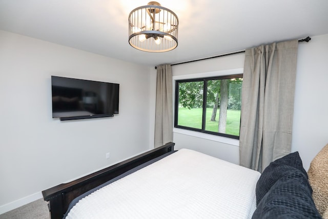 7719 Canary Rd SW, Alexandria, MN 56308 - bedroom with carpet flooring and a chandelier