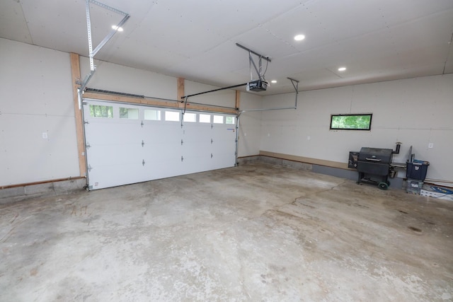 7719 Canary Rd SW, Alexandria, MN 56308 - garage featuring a garage door opener and recessed lighting