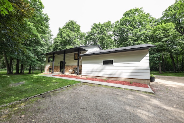 7719 Canary Rd SW, Alexandria, MN 56308 - view of home's exterior with a yard and view of scattered trees