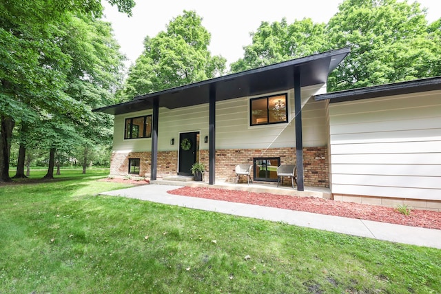 7719 Canary Rd SW, Alexandria, MN 56308 - raised ranch featuring brick siding and a front yard