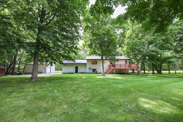 7719 Canary Rd SW, Alexandria, MN 56308 - view of grassy yard with an outbuilding, stairs, and a wooden deck