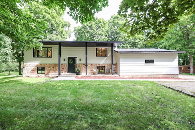 7719 Canary Rd SW, Alexandria, MN 56308 - rear view of property with a lawn and brick siding