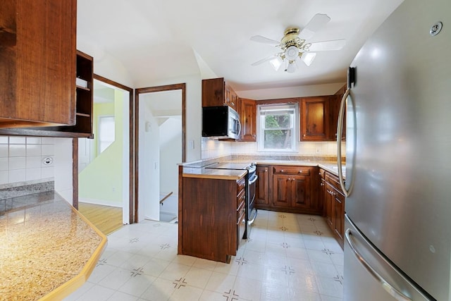 1105 9th Ave NW, Rochester, MN 55901 - kitchen with stainless steel appliances, tasteful backsplash, and light countertops