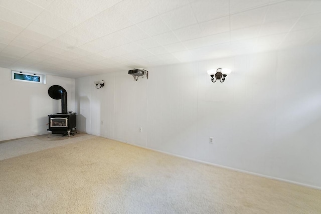 1105 9th Ave NW, Rochester, MN 55901 - unfurnished living room with a wood stove and carpet