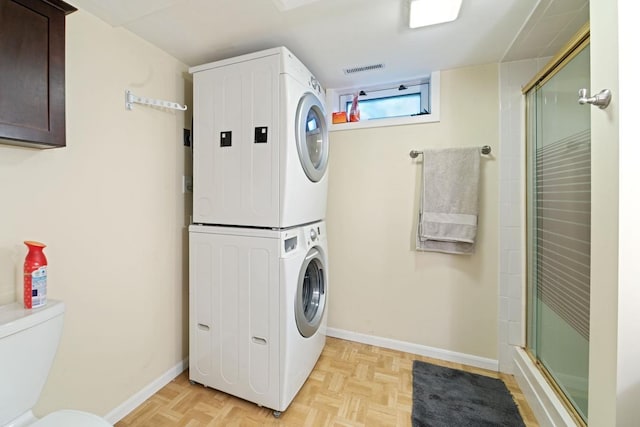 1105 9th Ave NW, Rochester, MN 55901 - laundry room with stacked washing machine and dryer and baseboards
