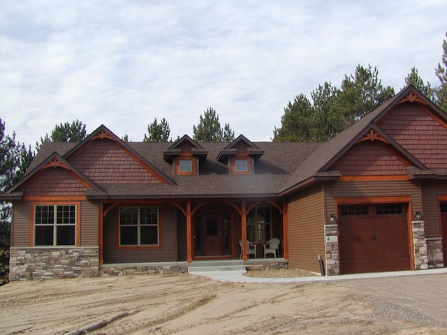 1176X Forestview Dr, Baxter, MN 56425 - craftsman house with stone siding, covered porch, and an attached garage