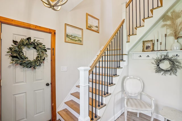 2352 90th Ave, Osceola, WI 54020 - stairs featuring wood finished floors and a chandelier