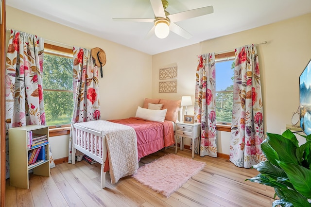 2352 90th Ave, Osceola, WI 54020 - bedroom featuring multiple windows, hardwood / wood-style floors, and ceiling fan