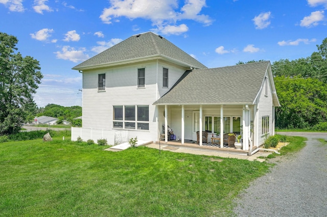 2352 90th Ave, Osceola, WI 54020 - back of property featuring a yard, roof with shingles, and a patio