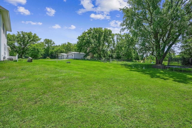 2352 90th Ave, Osceola, WI 54020 - view of yard featuring a trampoline and a detached garage