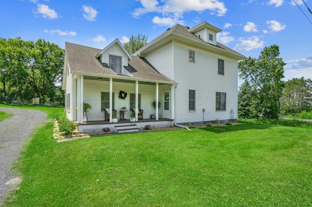 2352 90th Ave, Osceola, WI 54020 - view of front of house with a porch, a front lawn, and roof with shingles