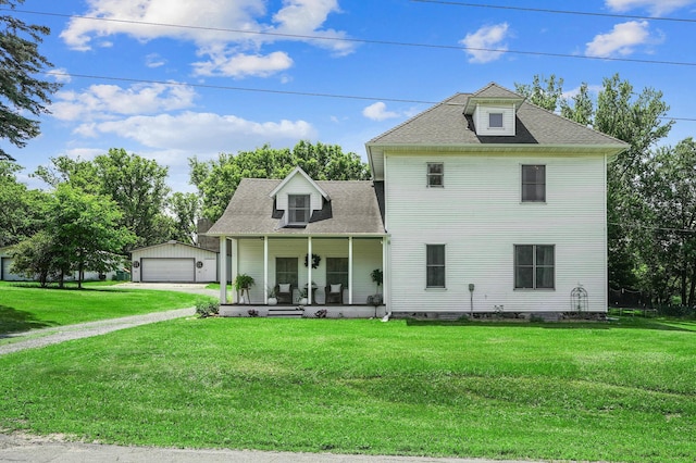 2352 90th Ave, Osceola, WI 54020 - view of front of home featuring covered porch, a garage, a front lawn, an outdoor structure, and roof with shingles