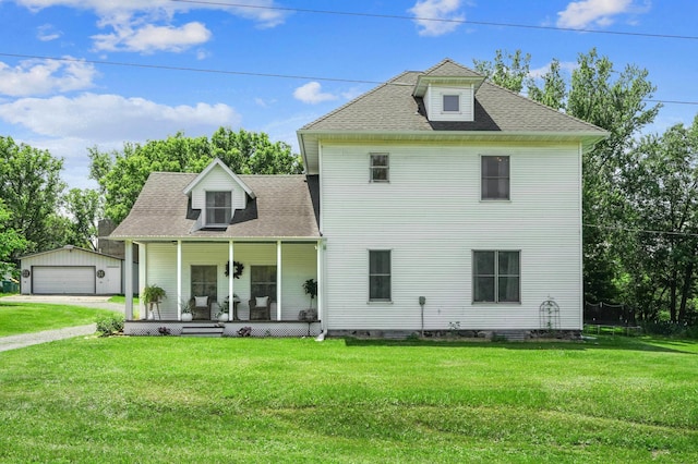 2352 90th Ave, Osceola, WI 54020 - view of front of property with covered porch, a front yard, an outdoor structure, a detached garage, and a shingled roof
