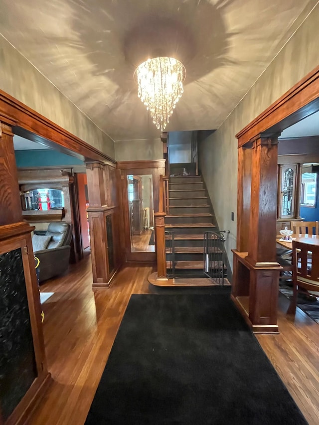 407 Minnesota St, Redwood Falls, MN 56283 - staircase with wood finished floors and a chandelier