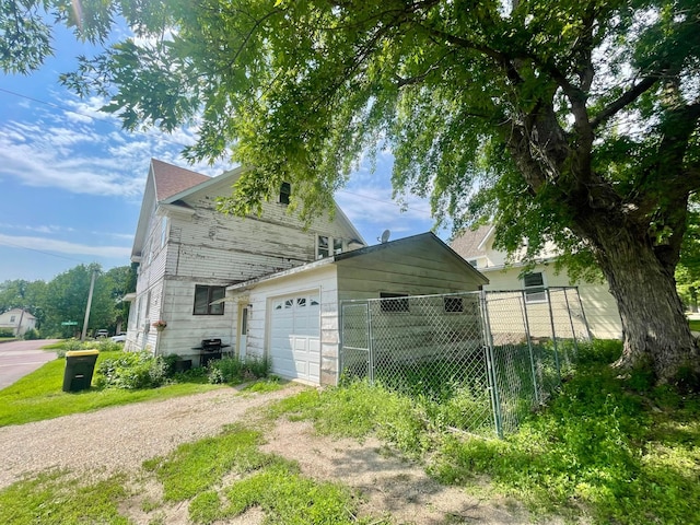 407 Minnesota St, Redwood Falls, MN 56283 - view of home's exterior with a garage and driveway