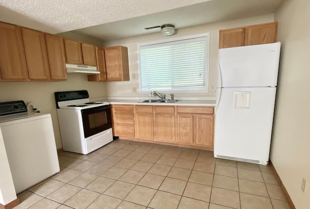 1111 13th St, Brainerd, MN 56401 - kitchen featuring white appliances, washer / clothes dryer, under cabinet range hood, light countertops, and light tile patterned floors
