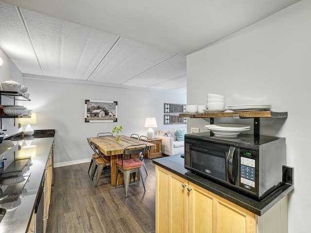 2700 44th St Unit 116, Minneapolis, MN 55410 - dining area featuring dark wood-type flooring and baseboards