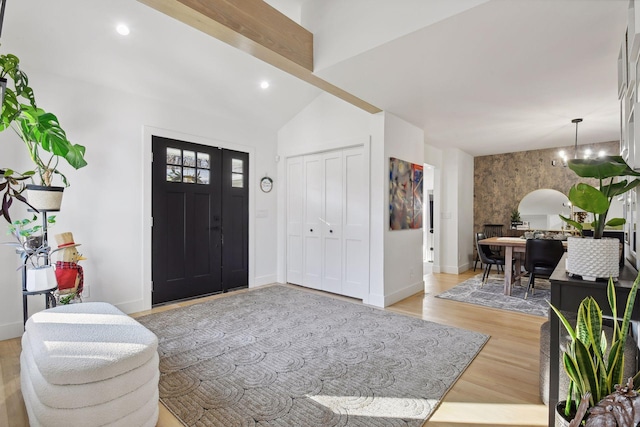 1611 Hill Ridge Ter, Minnetonka, MN 55305 - entrance foyer with light wood finished floors, recessed lighting, a chandelier, and an accent wall