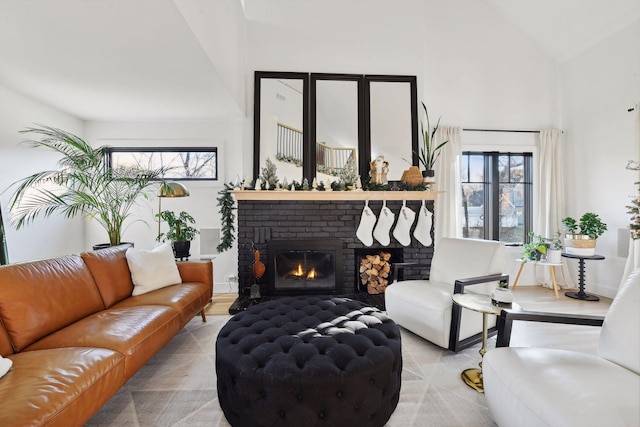1611 Hill Ridge Ter, Minnetonka, MN 55305 - living room featuring a fireplace, high vaulted ceiling, and light wood-style flooring