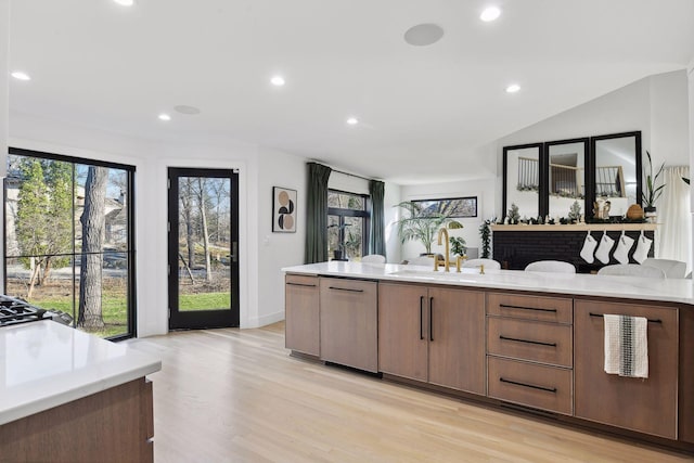 1611 Hill Ridge Ter, Minnetonka, MN 55305 - kitchen with light wood-style floors, recessed lighting, dishwasher, and vaulted ceiling