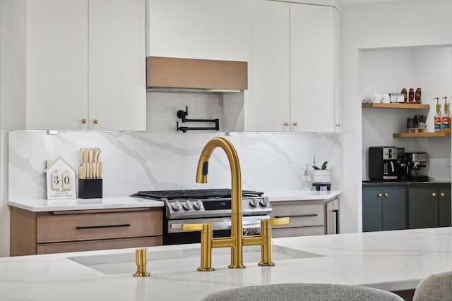 1611 Hill Ridge Ter, Minnetonka, MN 55305 - kitchen with decorative backsplash, white cabinetry, and gas stove
