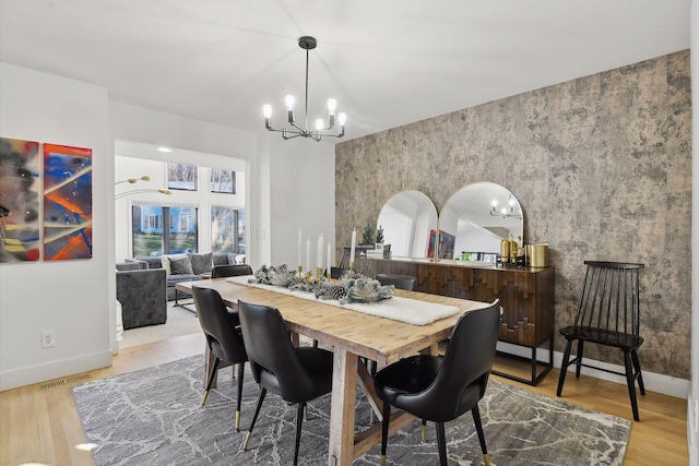 1611 Hill Ridge Ter, Minnetonka, MN 55305 - dining room featuring a chandelier and wood finished floors