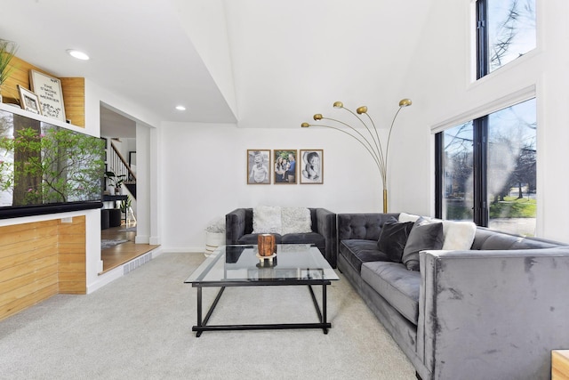 1611 Hill Ridge Ter, Minnetonka, MN 55305 - carpeted living area with stairway, recessed lighting, and a high ceiling