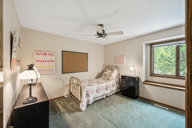 19402 Carson Cir NW, Elk River, MN 55330 - carpeted bedroom featuring a textured ceiling and ceiling fan