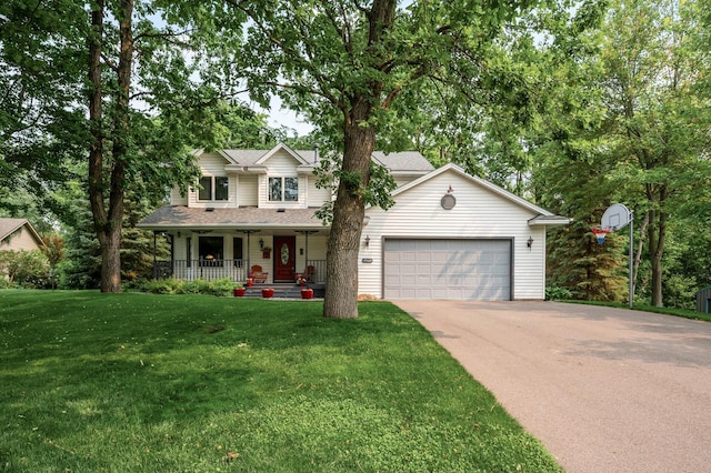 19402 Carson Cir NW, Elk River, MN 55330 - view of front of house featuring a porch, asphalt driveway, an attached garage, and a front yard