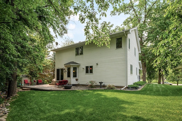 19402 Carson Cir NW, Elk River, MN 55330 - back of house with a yard and a patio area